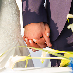 Image showing Wedding couple holding hands.