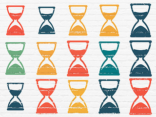 Image showing Time concept: Hourglass icons on wall background