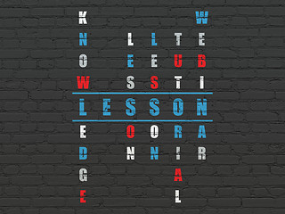 Image showing Education concept: word Lesson in solving Crossword Puzzle