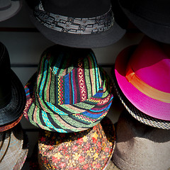 Image showing in london old red hat and black  the  fashion shop