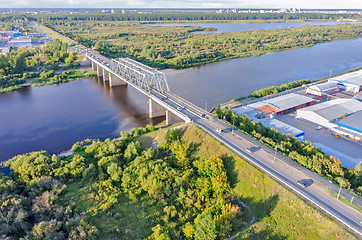 Image showing Traffic ob bridge through river. Tyumen. Russia