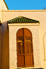 Image showing   yellow window in   old construction and wall  