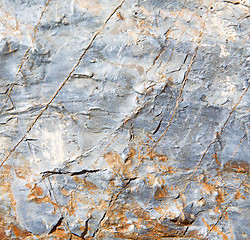 Image showing rocks stone and red orange gneiss in the wall of morocco