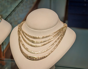 Image showing Beautiful jewelry - gold necklace on the mannequin.