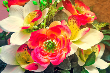 Image showing Small beautiful bouquet of artificial flowers