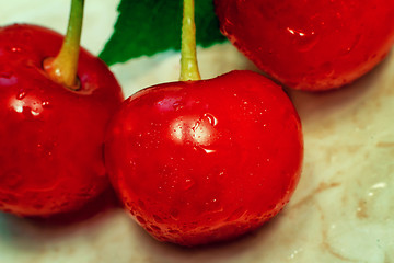 Image showing Bright red delicious ripe cherries