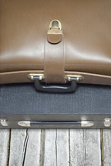 Image showing two suitcases on the wooden floor