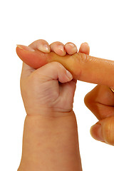 Image showing Baby holding finger