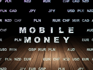 Image showing Money concept: Mobile Money in grunge dark room