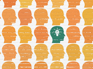 Image showing Finance concept: head with light bulb icon on wall background