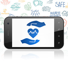 Image showing Insurance concept: Smartphone with Health Insurance on display