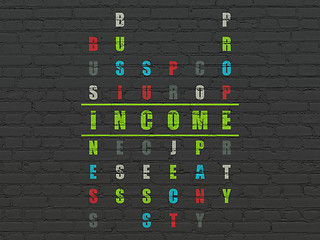 Image showing Finance concept: word Income in solving Crossword Puzzle