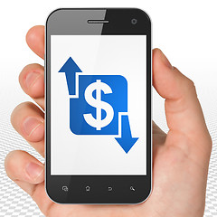 Image showing Business concept: Hand Holding Smartphone with Finance on display