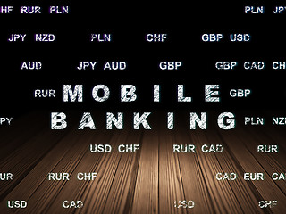 Image showing Money concept: Mobile Banking in grunge dark room