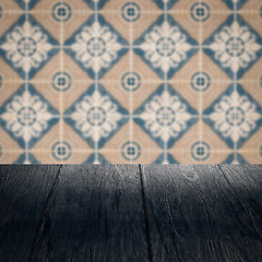 Image showing Wood table top and blur vintage ceramic tile pattern wall