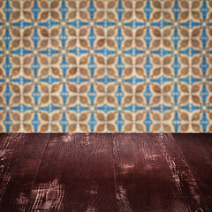 Image showing Wood table top and blur vintage ceramic tile pattern wall