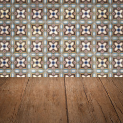 Image showing Wood table top and blur vintage ceramic tile pattern wall