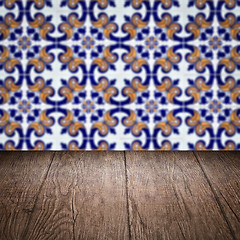 Image showing Wood table top and blur vintage ceramic tile pattern wall