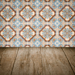 Image showing Wood table top and blur vintage ceramic tile pattern wall