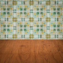 Image showing Wood table top and blur vintage ceramic tile pattern wall