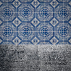 Image showing Wood table top and blur vintage ceramic tile pattern wall