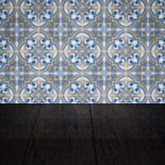 Image showing Wood table top and blur vintage ceramic tile pattern wall