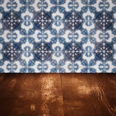 Image showing Wood table top and blur vintage ceramic tile pattern wall