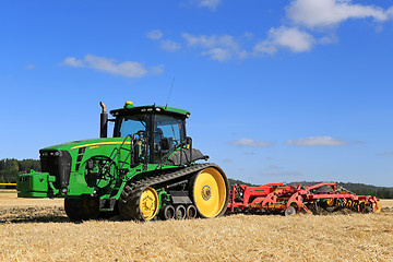 Image showing John Deere 8345RT Tracked Tractor and Vaderstad Cultivator on Fi