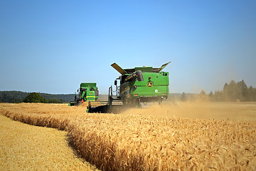 Image showing Two John Deere Modern Combines Harvest Barley