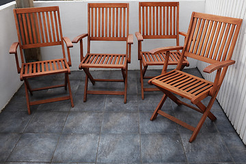 Image showing four folding wooden chairs 