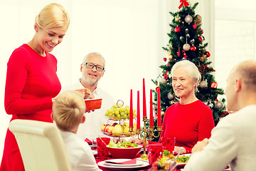 Image showing smiling family having holiday dinner at home