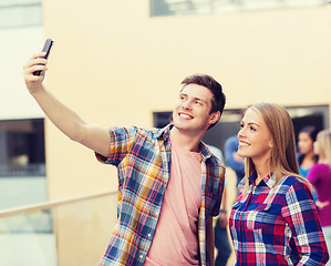 Image showing group of smiling students outdoors