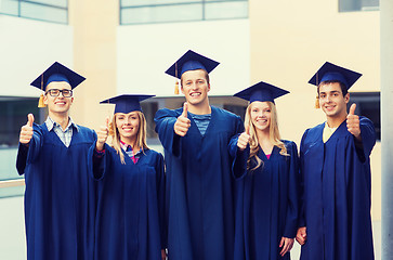 Image showing group of smiling students in mortarboards