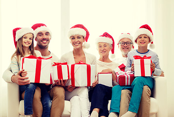 Image showing happy family sitting on couch at home