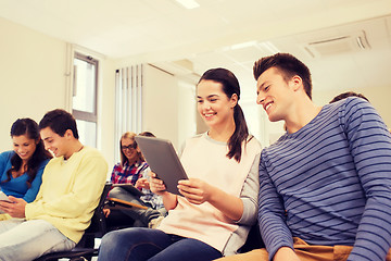 Image showing group of smiling students with tablet pc