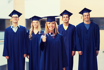 Image showing group of smiling students in mortarboards