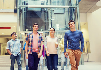 Image showing group of smiling students with paper coffee cups