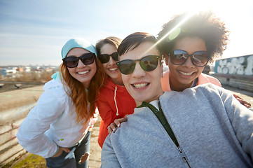 Image showing group of happy friends taking selfie on street