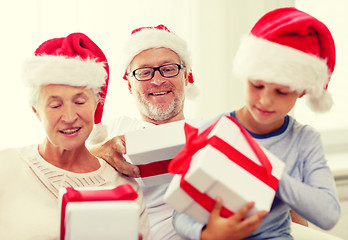 Image showing happy family sitting on couch at home