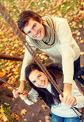 Image showing smiling couple hugging in autumn park