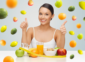 Image showing happy woman with healthy food showing thumbs up