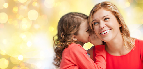 Image showing happy mother and girl whispering into ear