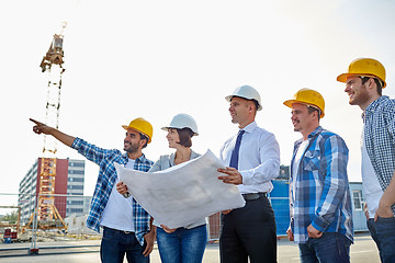 Image showing group of builders and architects with blueprint