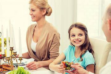 Image showing smiling family having holiday dinner at home