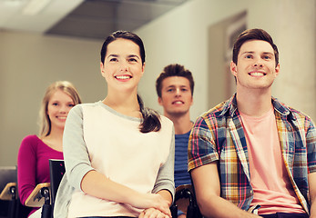 Image showing group of smiling students in lecture hall