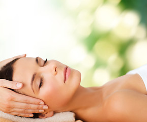 Image showing beautiful woman in spa salon having facial