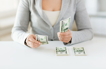 Image showing close up of woman hands counting us dollar money