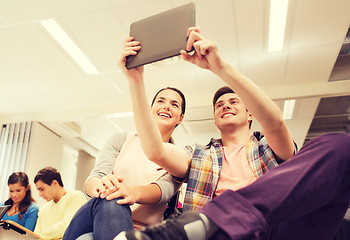 Image showing group of smiling students with tablet pc