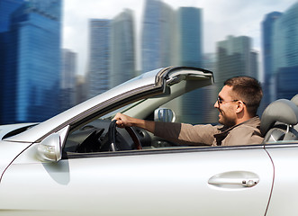 Image showing happy man driving cabriolet car outdoors