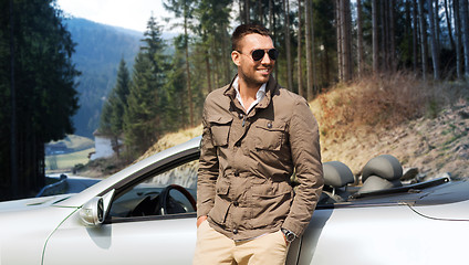 Image showing happy man near cabriolet car over nature